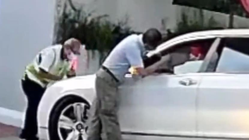 Driver seen pushing Bentley against school security officer to be charged, along with son who is car owner