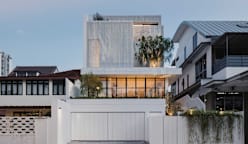 Behind the mysterious white facade of this Singapore house lies a warm, light-filled home