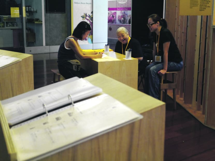 Ms Chien (centre) at Will-Not, where participants can pen down their end-of-life wishes. Photo: ArtWOK