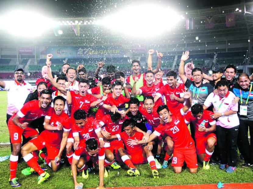 Singapore's Under-23 team celebrating winning the bronze medal at the 2013 SEA Games in Myanmar. Pundits said Singapore should set a goal of winning its first SEA Games football title first. Singapore's Under-23 team celebrating winning the bronze medal at the 2013 SEA Games in Myanmar. Pundits said Singapore should set a goal of winning its first SEA Games football title first.