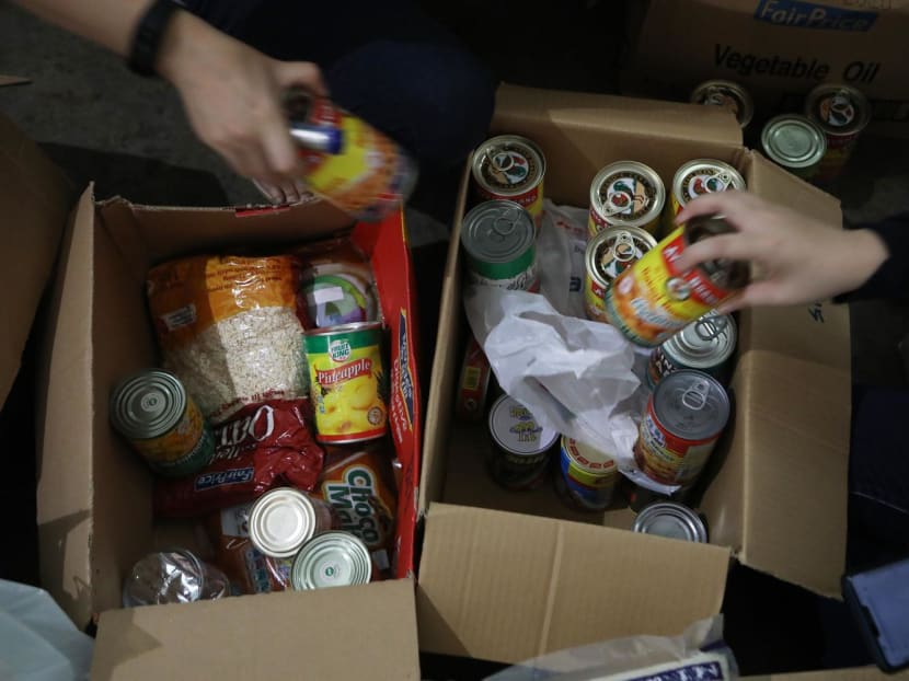 Donated food items being sorted at a food bank in Tanjong Pagar. Donated food items being sorted at a food bank in Tanjong Pagar.