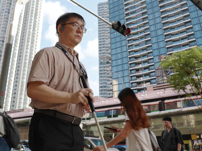 What one man is teaching Singaporeans about living with the visually impaired – a crossing, a tour, a firm ‘no’ at a time