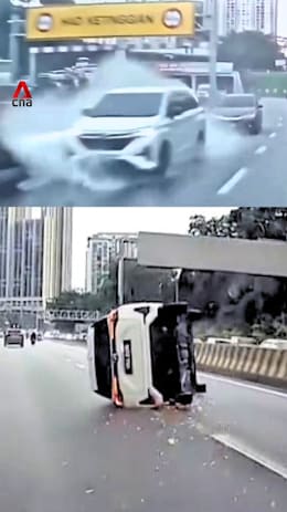Water puddle causes car to skid, overturn on Malaysian highway
