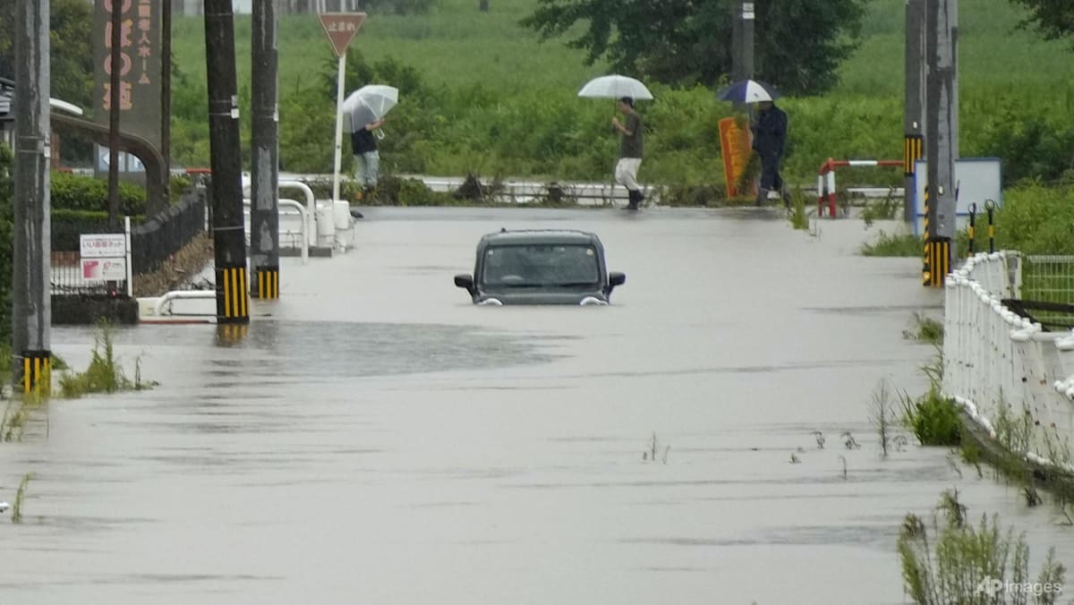 Photo: channelnewsasia.com Heavy Rain and Flooding Strand Residents in North-Central Japan