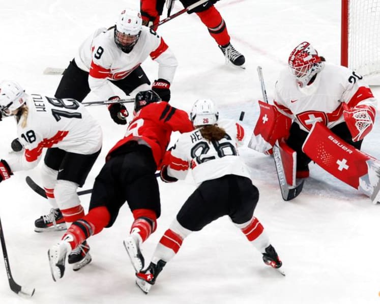 Ice hockey-Canada look to captain Poulin in title defence after goal-scoring record