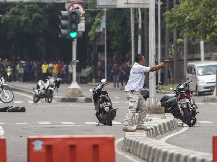 Seven dead in Jakarta blasts, gunfight