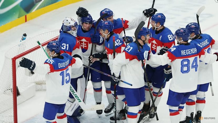 Ice hockey-Slovakia win group, US beat Denmark, Finland, Latvia notch wins