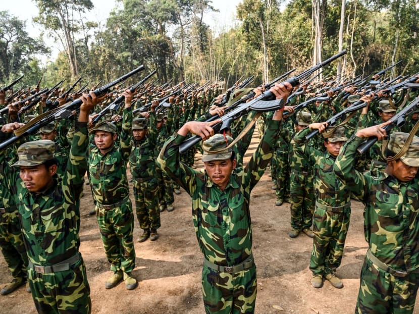 In this photo taken on March 8, 2023, members of the ethnic rebel group Ta'ang National Liberation Army (TNLA) take part in a training exercise at their base camp in the forest in Myanmar's northern Shan State.