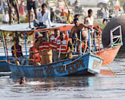 At least 10 dead after boat hits bridge in India: police