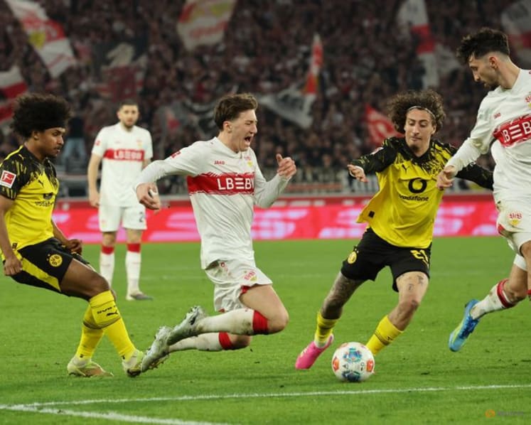 Dortmund score twice in stoppage time to beat Stuttgart 2-0