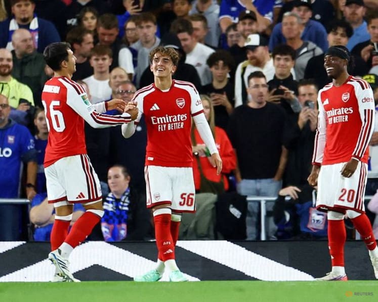 Teenager Dowman scores twice as Arsenal progress in League Cup