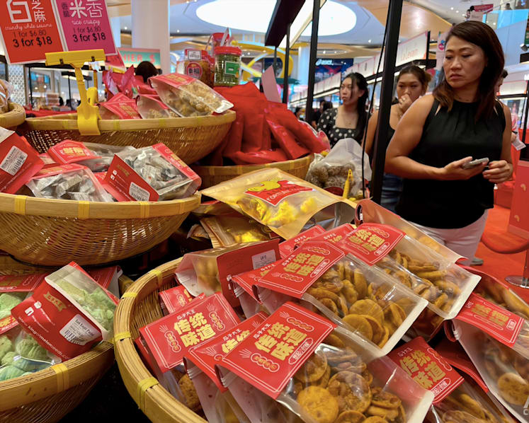Rising cost of living, increased competition result in slow sales for Chinese New Year snacks