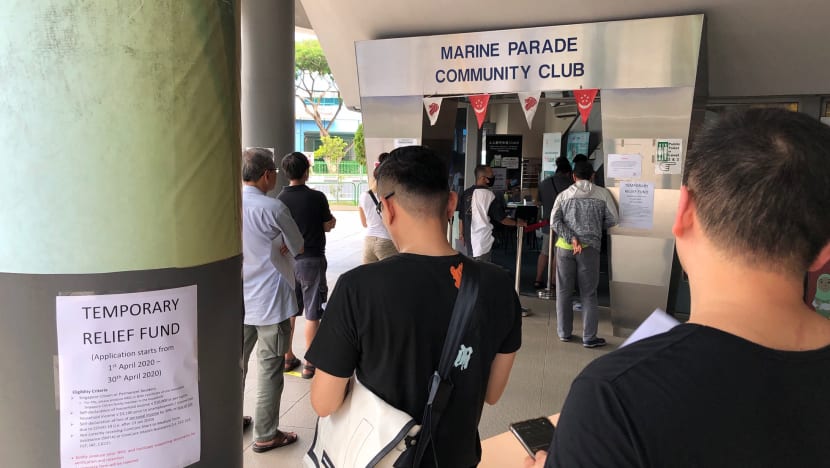 Thousands of people queue to get S$500 financial aid at social service offices and CCs as applications open