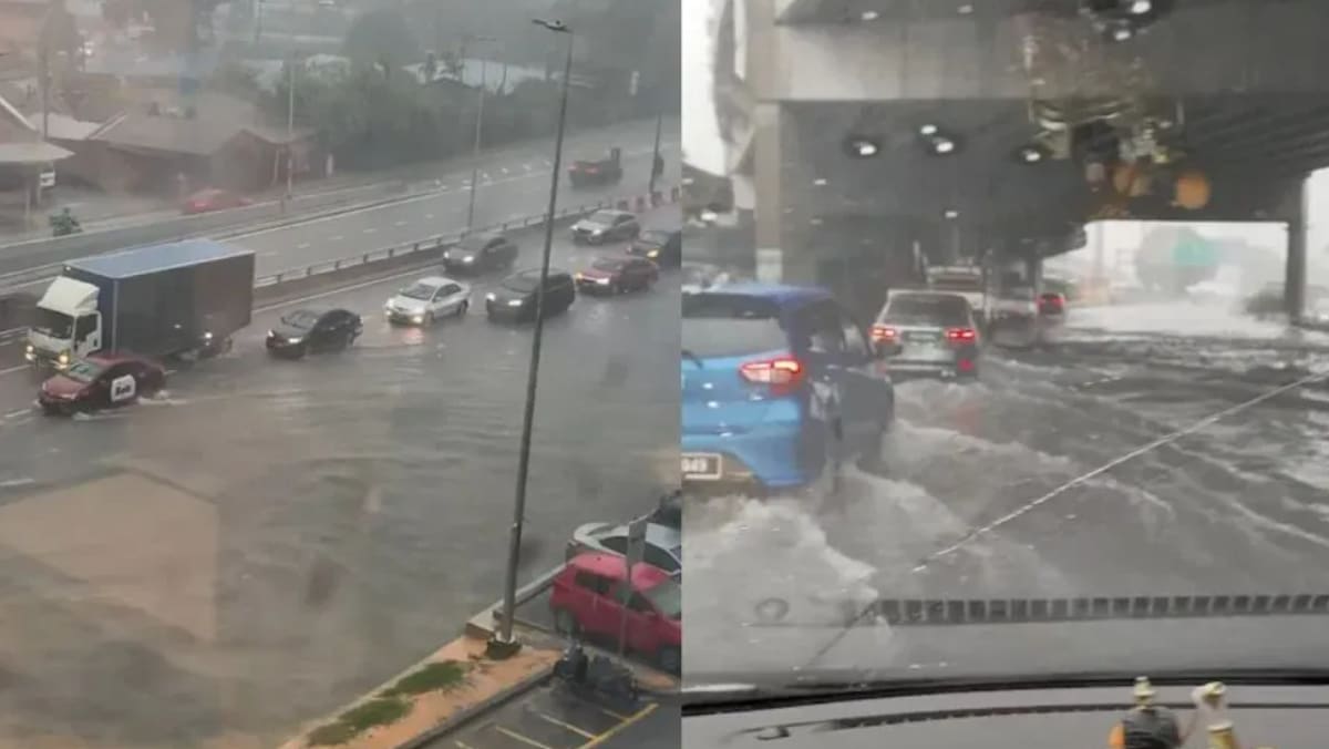 吉隆坡暴雨来袭 道路淹水车辆涉水前行 - 8world