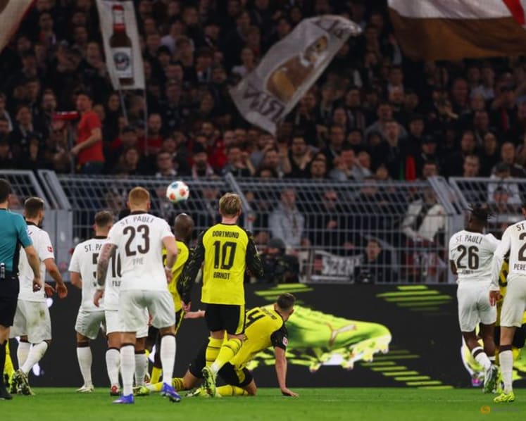 Dortmund waste two-goal lead but score stoppage-time win over St Pauli