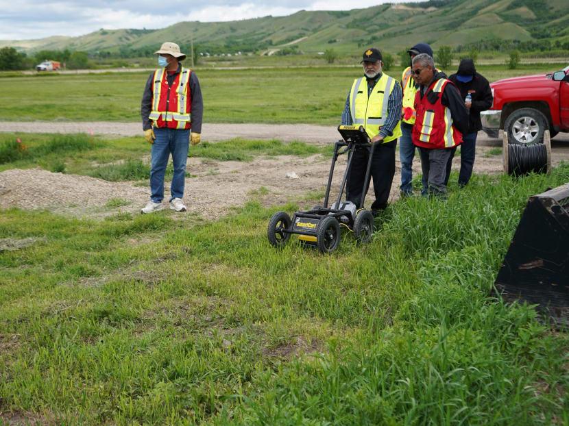 A crew performs a ground-penetrating radar search of a field, where the Cowessess First Nation said they had found 751 unmarked graves, near the former Marieval Indian Residential School in Grayson, Saskatchewan, Canada on June 18, 2021.