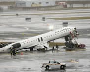 Two dead in New York jet collision, Trump deploys ICE to strained US airports