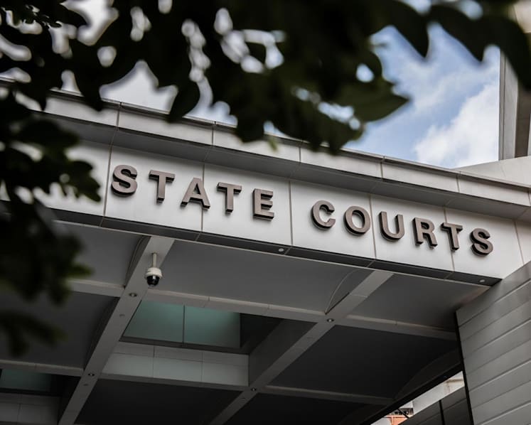 Jail, fine and caning for secondary school CCA coach who molested 13 male students