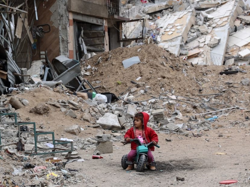 A Palestinian child plays near a building destroyed by earlier Israeli bombardment in Gaza City on April 8, 2024, amid the ongoing conflict between Israel and the Palestinian Hamas militant group. A Palestinian child plays near a building destroyed by earlier Israeli bombardment in Gaza City on April 8, 2024, amid the ongoing conflict between Israel and the Palestinian Hamas militant group.