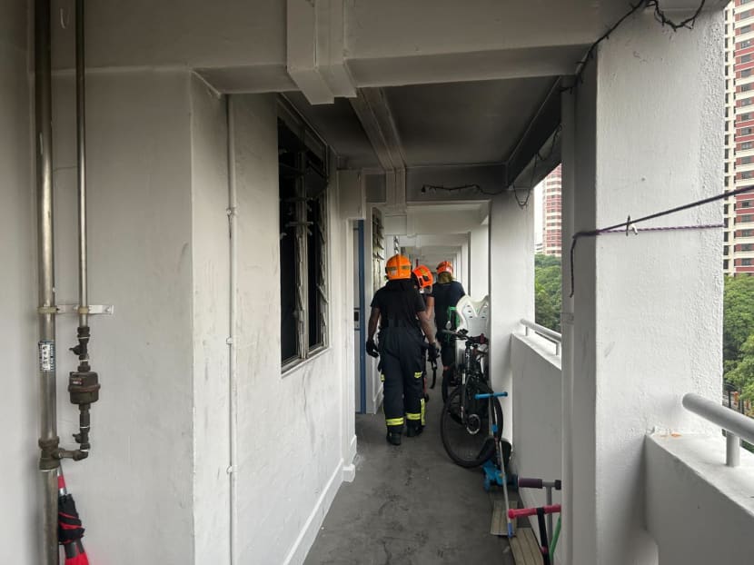 Singapore Civil Defence Force personnel on the seventh floor of Block 71 along Redhill Road on Aug 14, 2023. Singapore Civil Defence Force personnel on the seventh floor of Block 71 along Redhill Road on Aug 14, 2023.