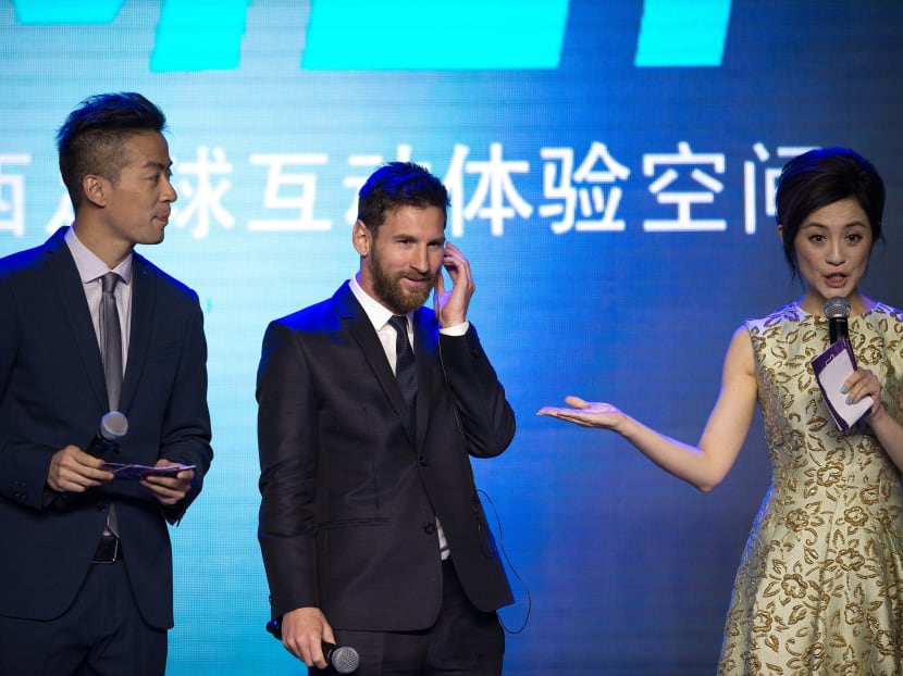 Lionel Messi (centre) attending the launch of the amusement park at a hotel in Beijing. Photo: AFP