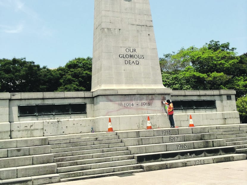 A worker cleaning the Cenotaph after the vandalism. The Cenotaph honours those who died in World Wars I and II.