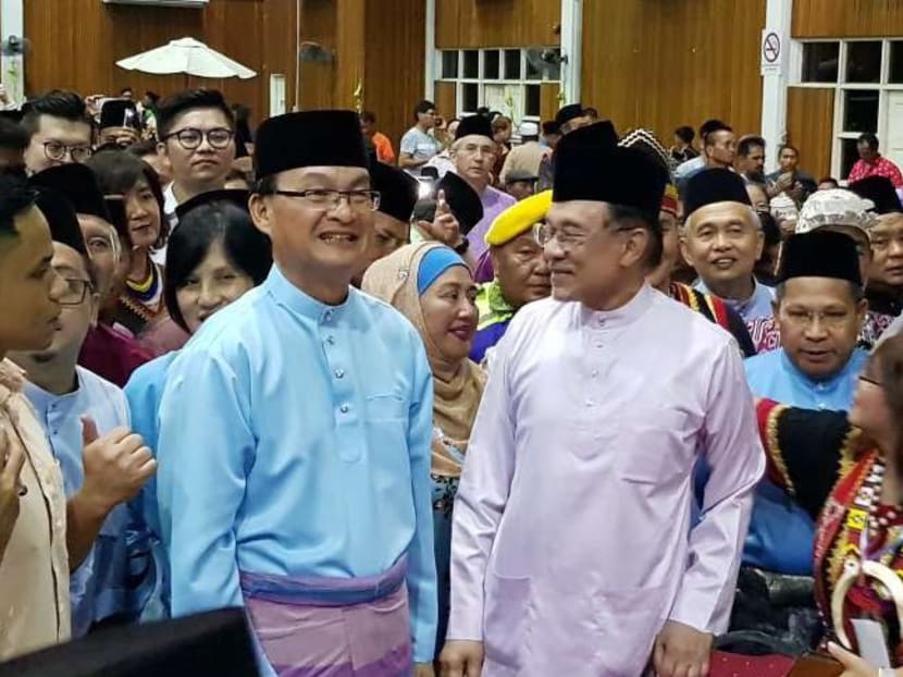 PKR president Anwar Ibrahim (right) with Sarawak PKR chief Baru Bian at the party's Gawai Raya open house in Kuching on Sunday (June 17).