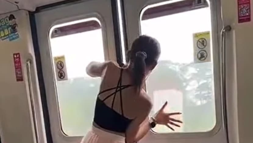 Man seen in viral video trying to force open MRT train doors charged with public nuisance Man seen in viral video trying to force open MRT train doors charged with public nuisance
