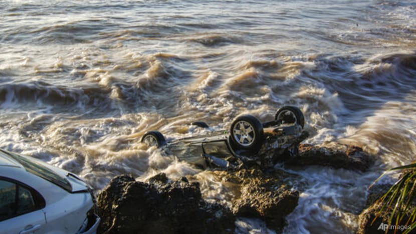Floods sweep cars into sea, damage homes in northeast Spain