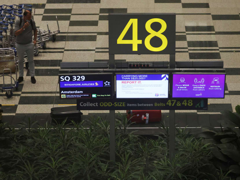 Passengers from Amsterdam arrive at Changi Airport under Singapore’s expanded vaccinated travel lane (VTL) quarantine-free travel scheme on Oct 20, 2021. 
