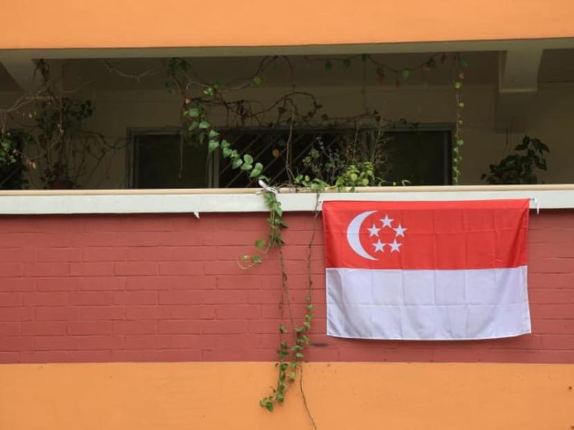 Elson Ong Yong Liang, 25, is accused of using a lighter to burn a Singapore flag along the common corridor on the 13th floor of Block 774 Woodlands Crescent. Elson Ong Yong Liang, 25, is accused of using a lighter to burn a Singapore flag along the common corridor on the 13th floor of Block 774 Woodlands Crescent.