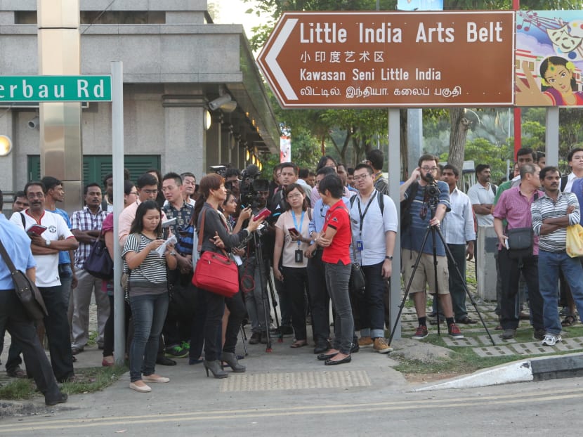 Media and public onlookers waiting for a press debrief a day after the Little India Riots. Photo by Don Wong, 09 Dec 2013.