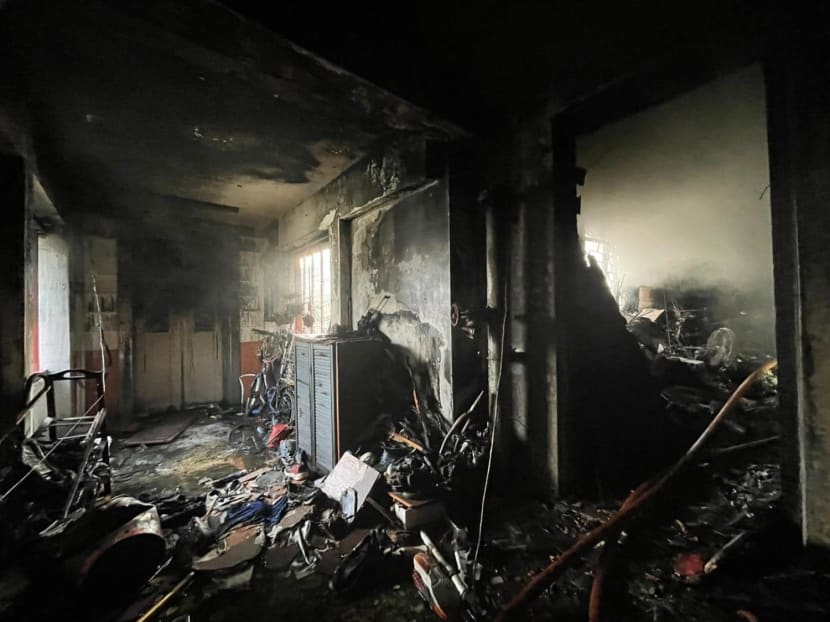 Damage caused by the fire along the corridor of the affected unit at Jurong East Street 21.