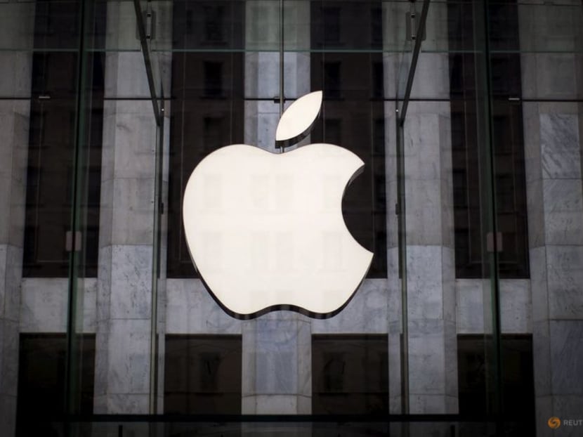 An Apple logo hangs above the entrance to the Apple store on 5th Avenue in the Manhattan borough of New York City, on July 21, 2015.