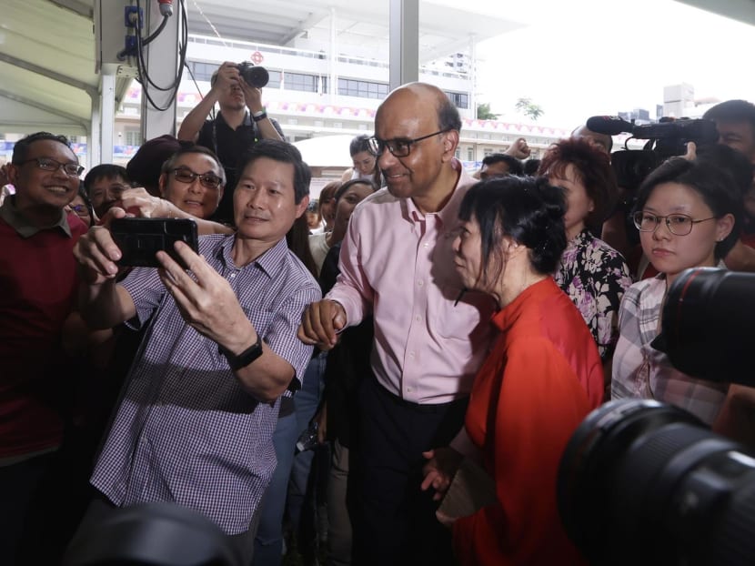 Presidential candidate Tharman Shanmugaratnam with his wife and supporters at the nomination centre on Aug 22, 2023.
