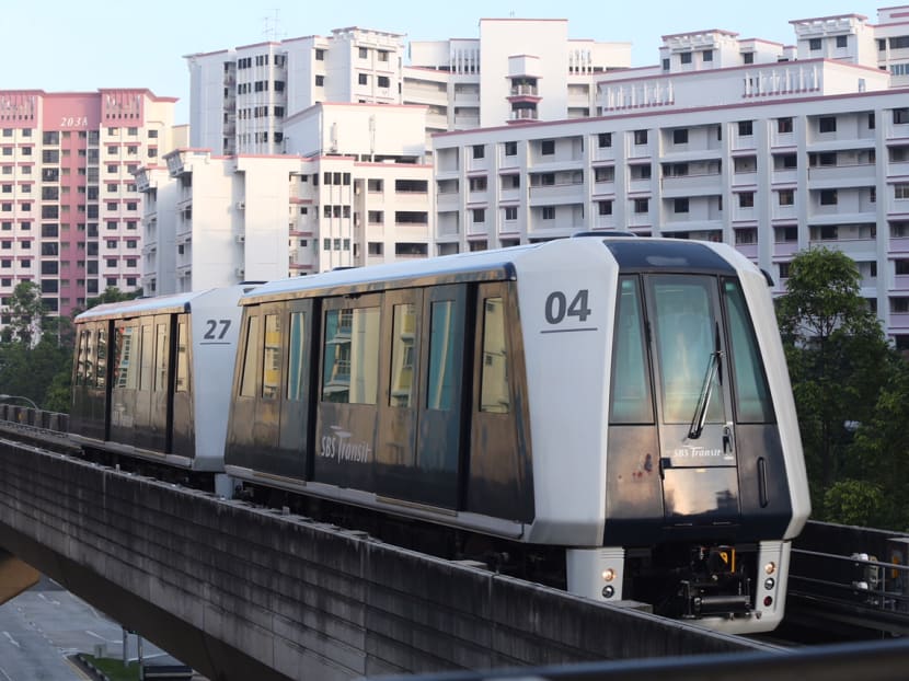 A Light Rapid Transit train pulling into a station in Sengkang in 2016.