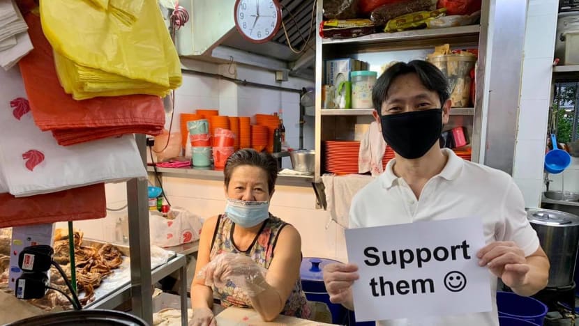 Police investigating MP Louis Ng for holding up smiley face sign supporting hawkers