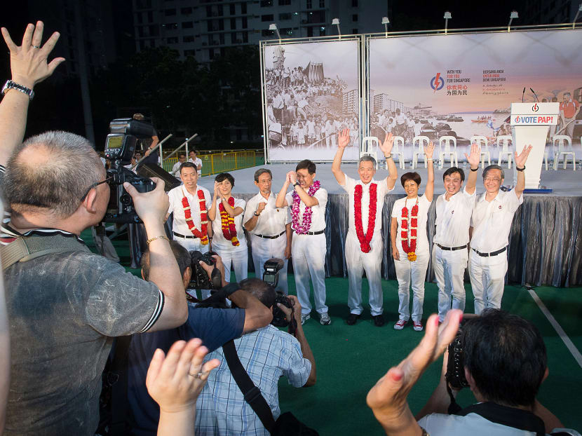 (From left) Mr Melvin Yong, Ms Joan Pereira, former Senior Minister of State Sidek Saniff, labour chief Chan Chun Sing, PM Lee Hsien Loong, Senior Minister of State Indranee Rajah, Dr Chia Shi-Lu and Mr Sam Tan thank the supporters after the end of the PAP rally yesterday. Almost all who spoke touched on the importance of mutual trust between the Government and voters. Photo: Ray Chua