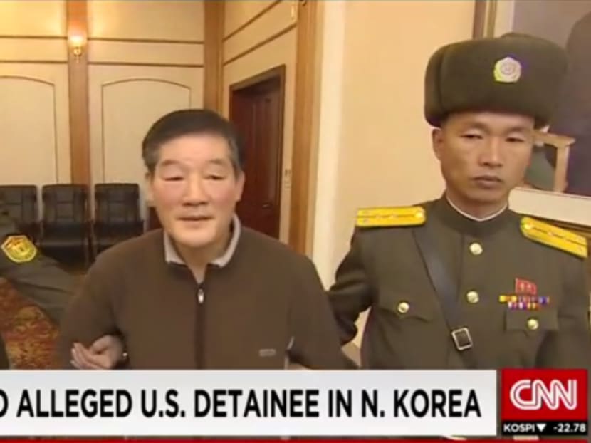 Screengrab of a CNN video showing Kim Dong Chul being escorted by North Korean authorities in Pyongyang.