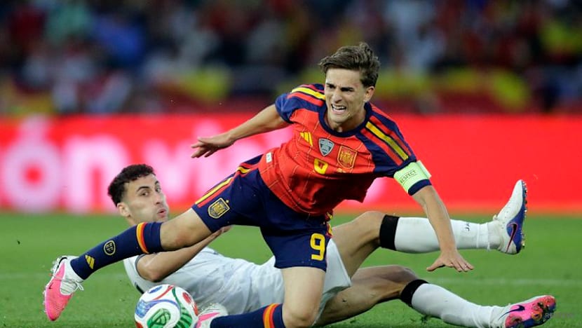 Second-string Spain held by Iraq in low-key World Cup send-off