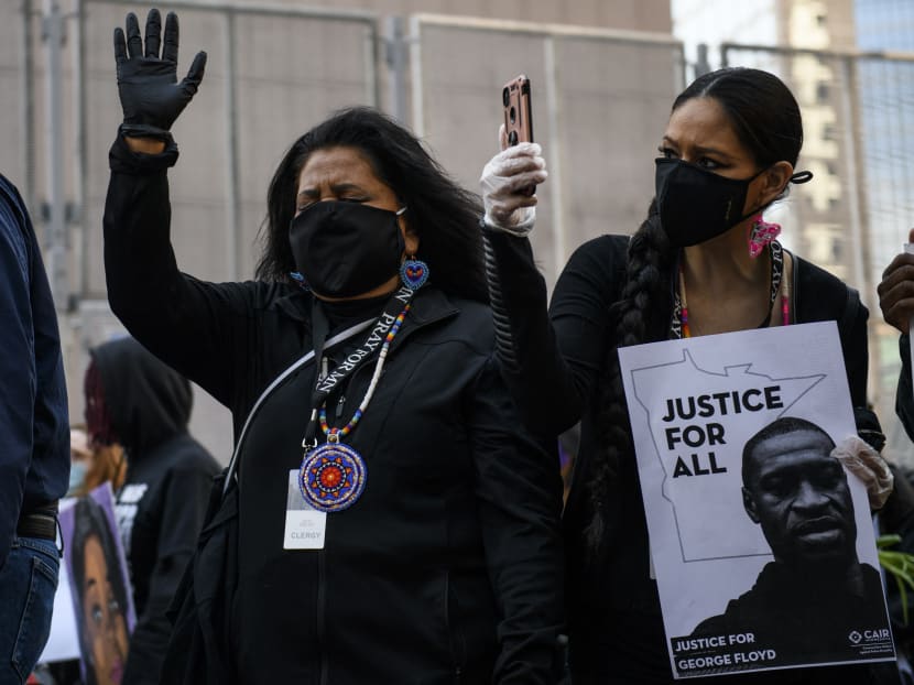 People gather during a demonstration in honor of George Floyd on March 7, 2021 in Minneapolis, Minnesota.