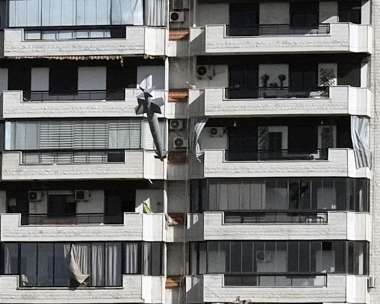 Photos capture exact moments an Israeli missile strikes building in Beirut