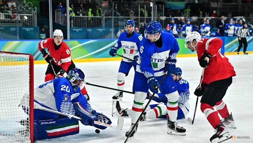 Ice hockey-Swiss ease past Italy to set up quarter-final with Finland