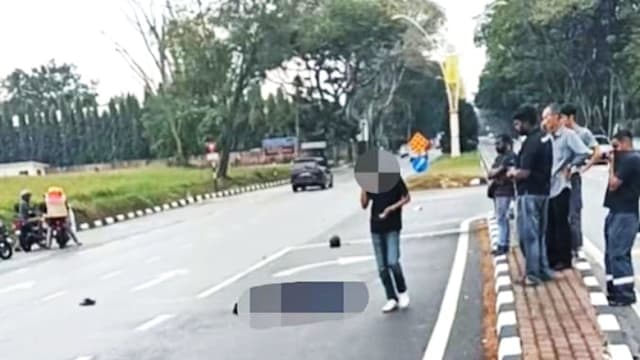 疑违规转入反向车道酿祸 马国老妇撞死警察弃车逃被捕