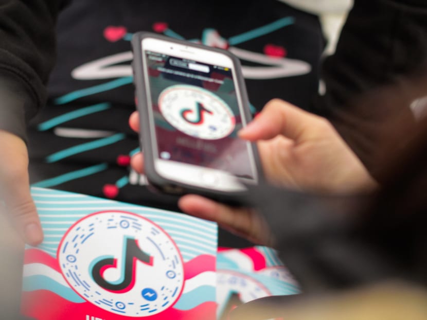 On TikTok, the mass grouping of people together in space is replaced by a more subtle form of togetherness through imitation and synchronised movement, says the author. On TikTok, the mass grouping of people together in space is replaced by a more subtle form of togetherness through imitation and synchronised movement, says the author.