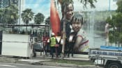 Two to be charged for instructing foreign workers to hold placards in illegal protests