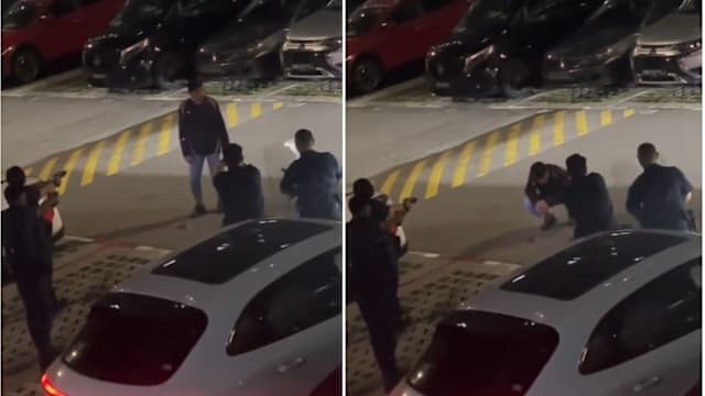 男子持双锯危站停车场 警拔电击枪围堵将其制伏