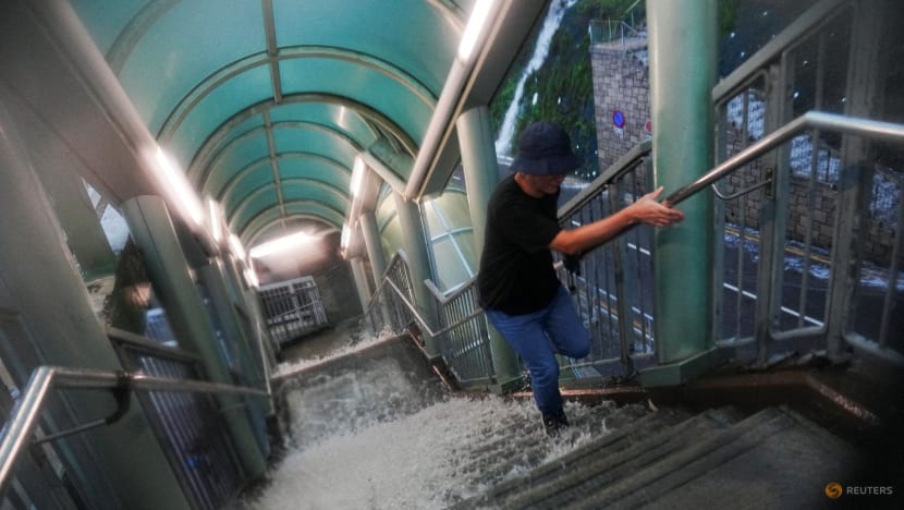 Hong Kong issues highest weather warning, as rains shut schools, courts and hospital wards