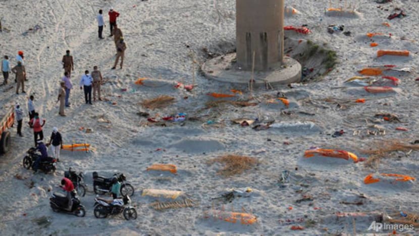 Indian police find bodies on riverbank amid raging COVID-19