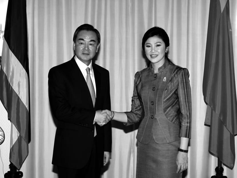 China’s Foreign Minister Wang Yi with Thai Prime Minister Yingluck Shinawatra during his visit to Bangkok on May 1. Photo: Reuters